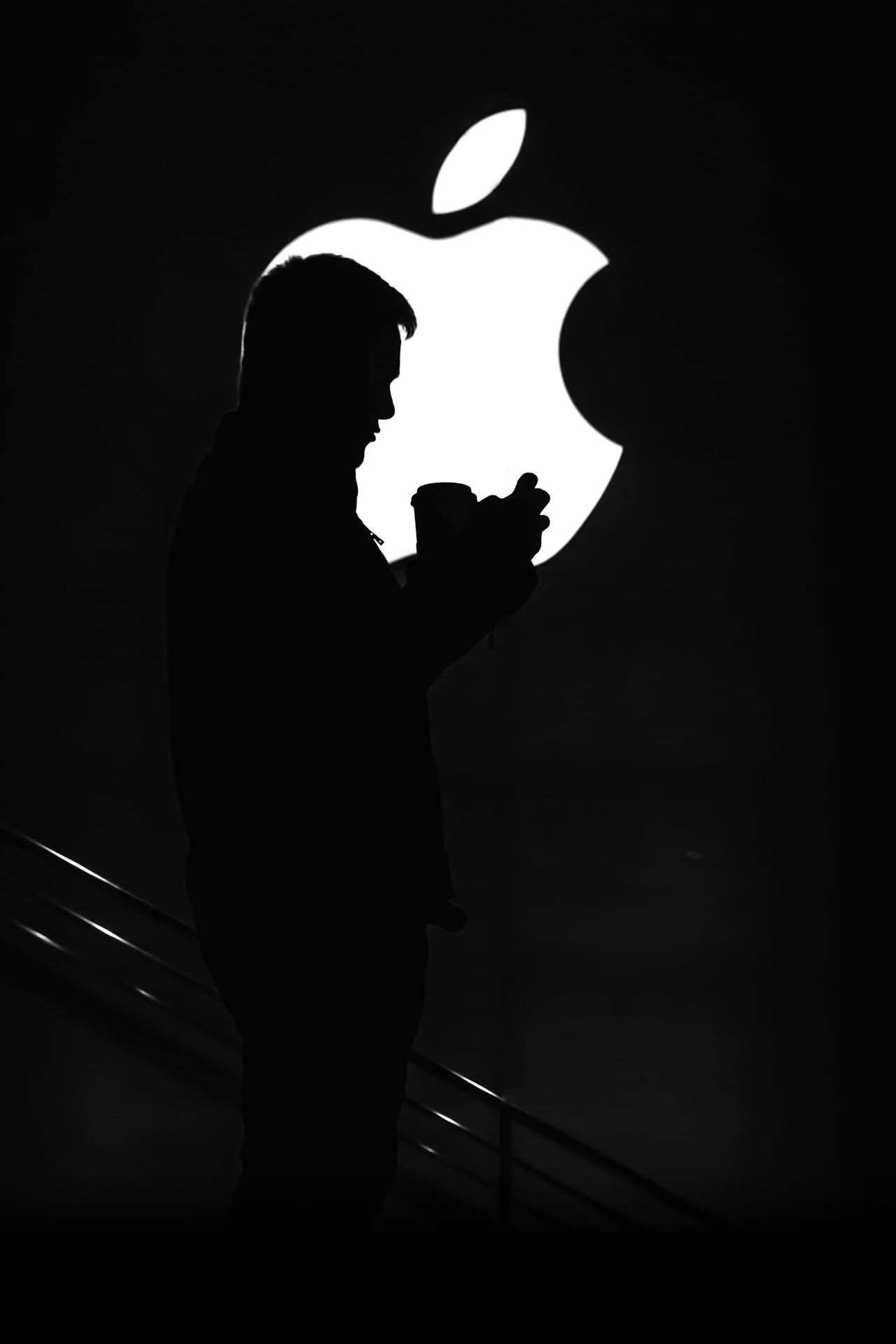 Apple Logo with Person's Silhouette in Front