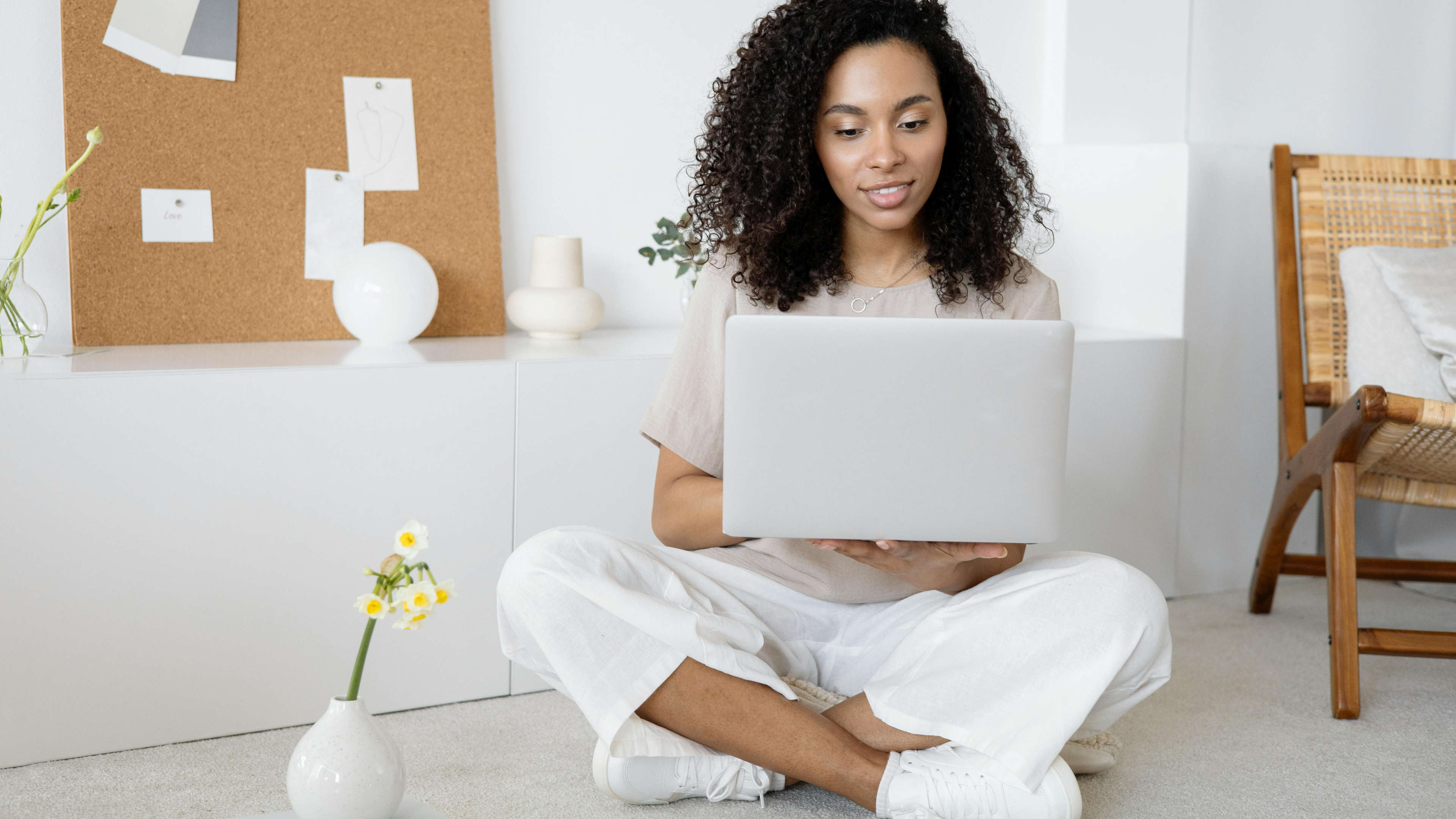 Woman sitting with laptop