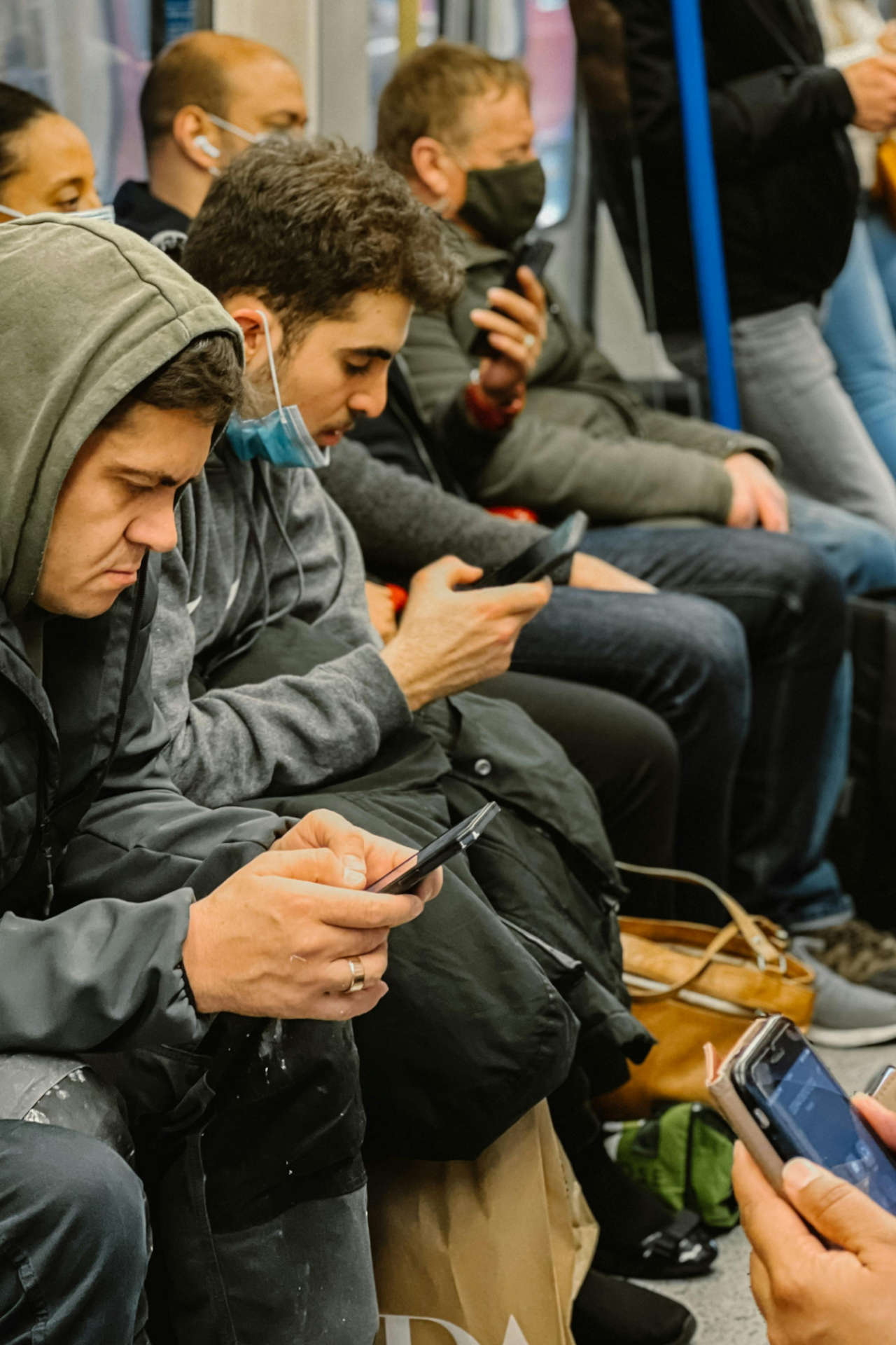 Diverse People on Subway Using Mobile Devices