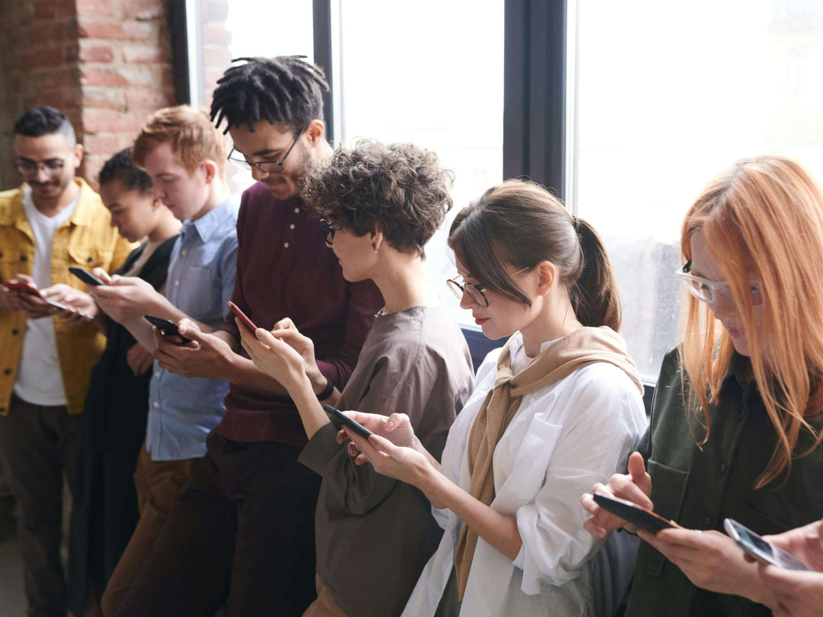 A Group of People Using Mobile Devices