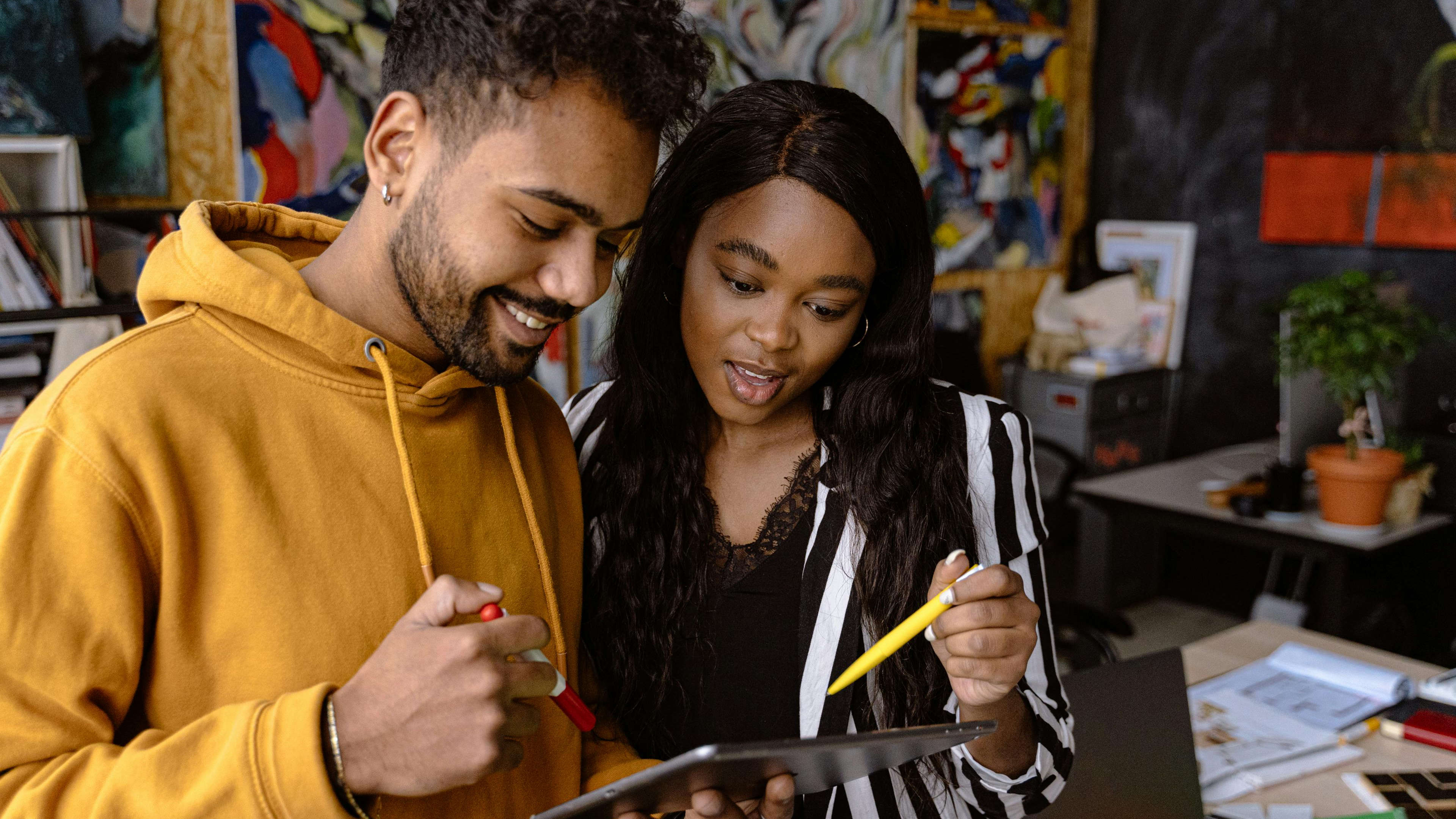 Man and Woman using Tablet