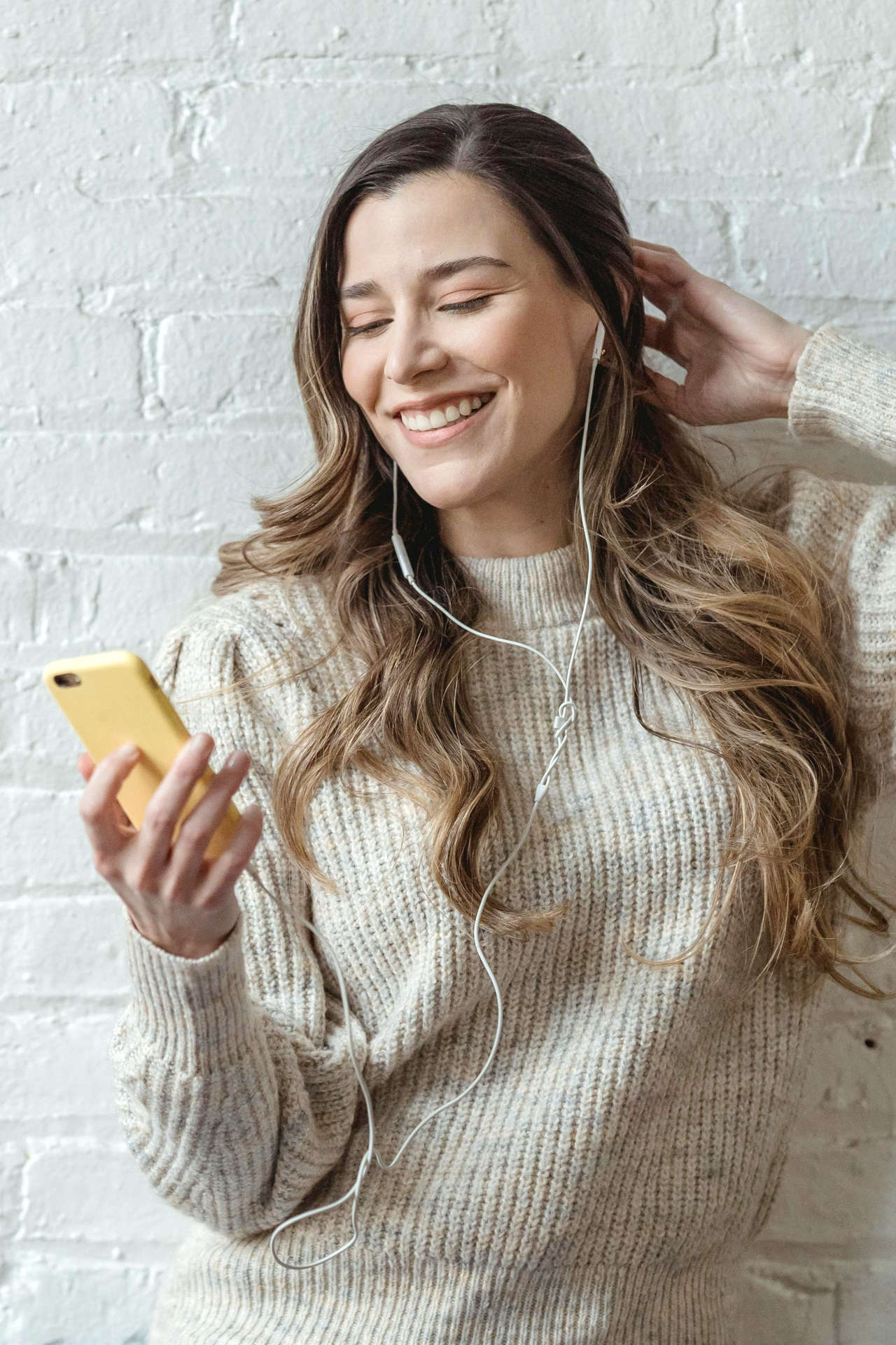 Smiling Woman Using Phone