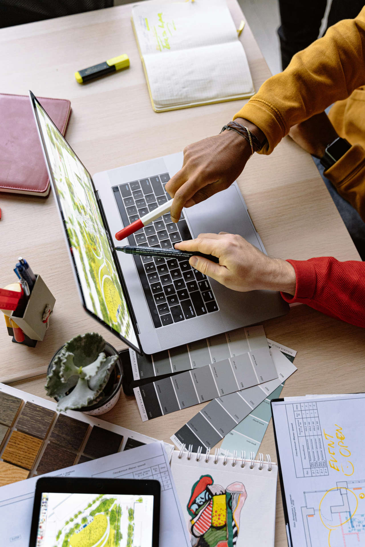 Designers Pointing at Screen