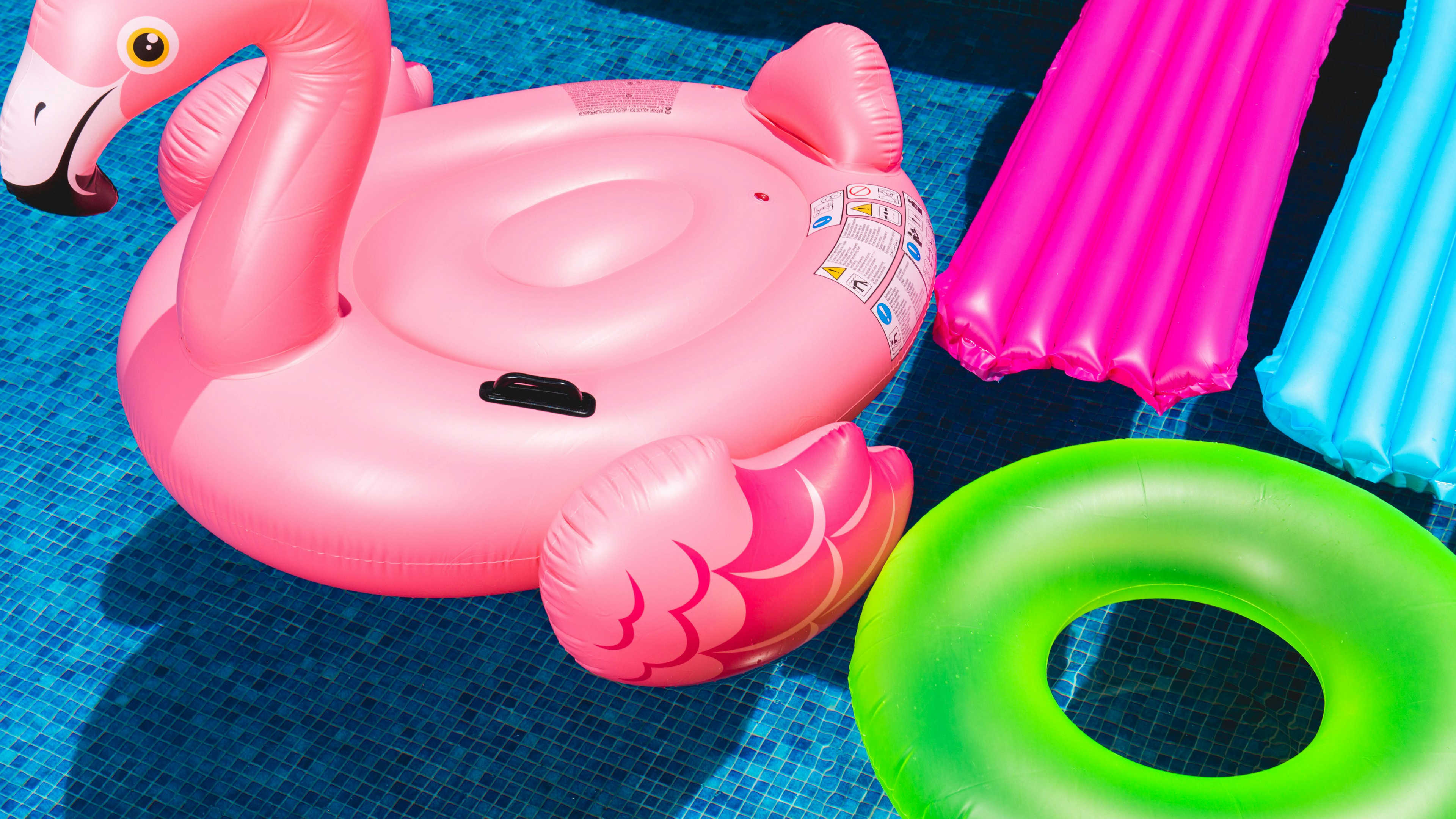 Bright, colorful floaties in a pool