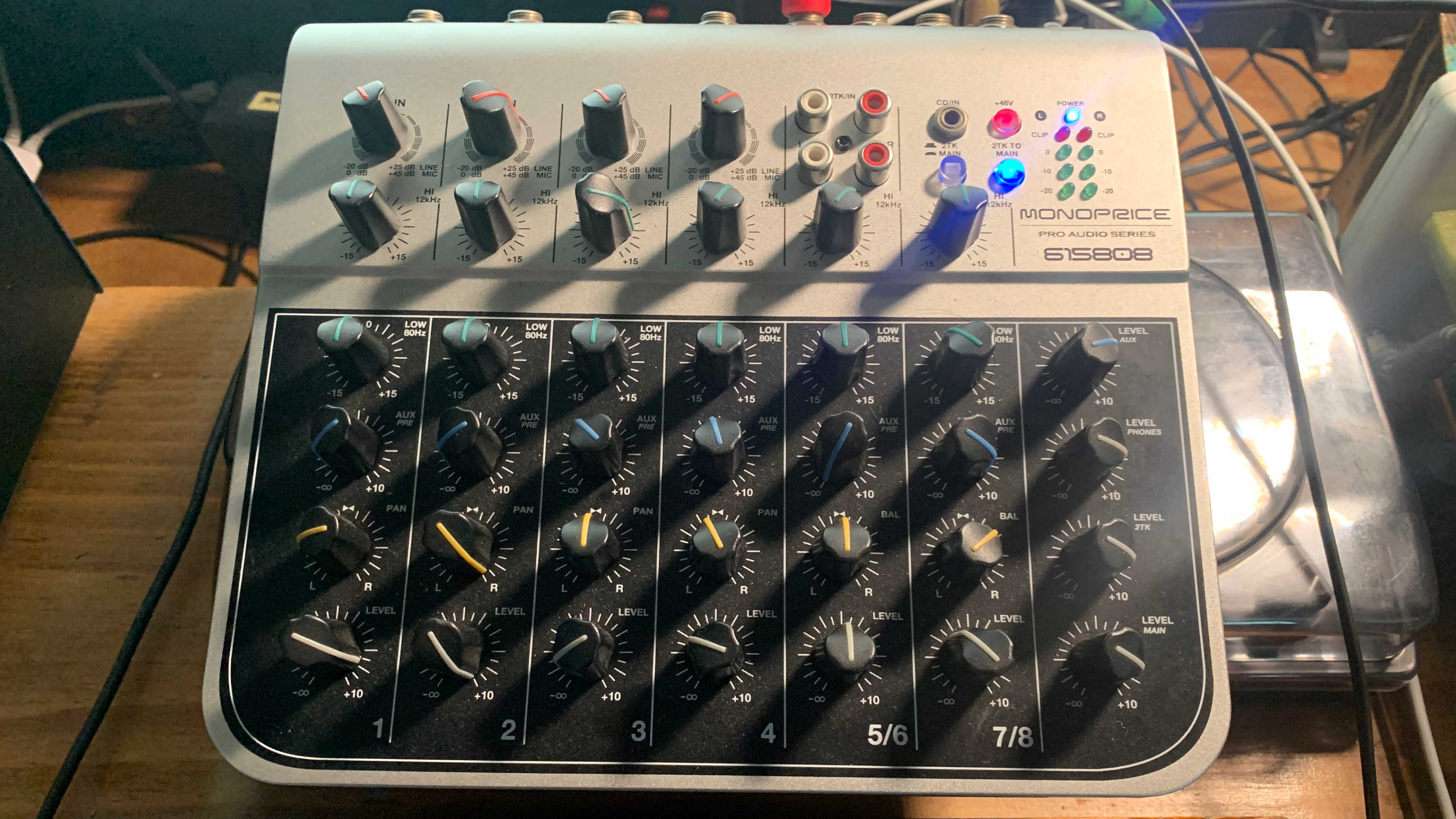 A Monoprice 615808 audio interface stacked on a Pioneer Rmx-1000