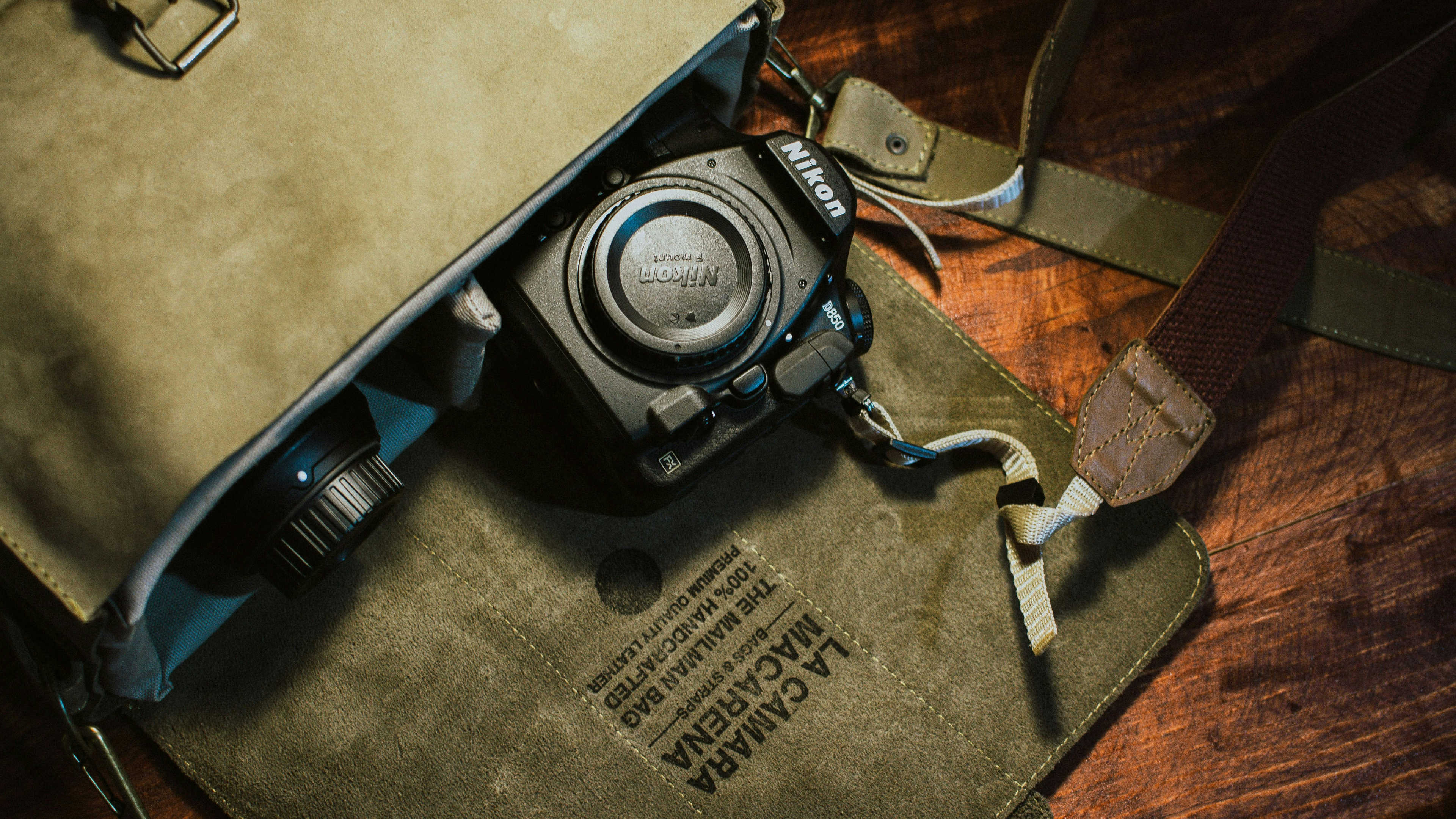 A flatlay image of various camera equipment and accessories arranged neatly