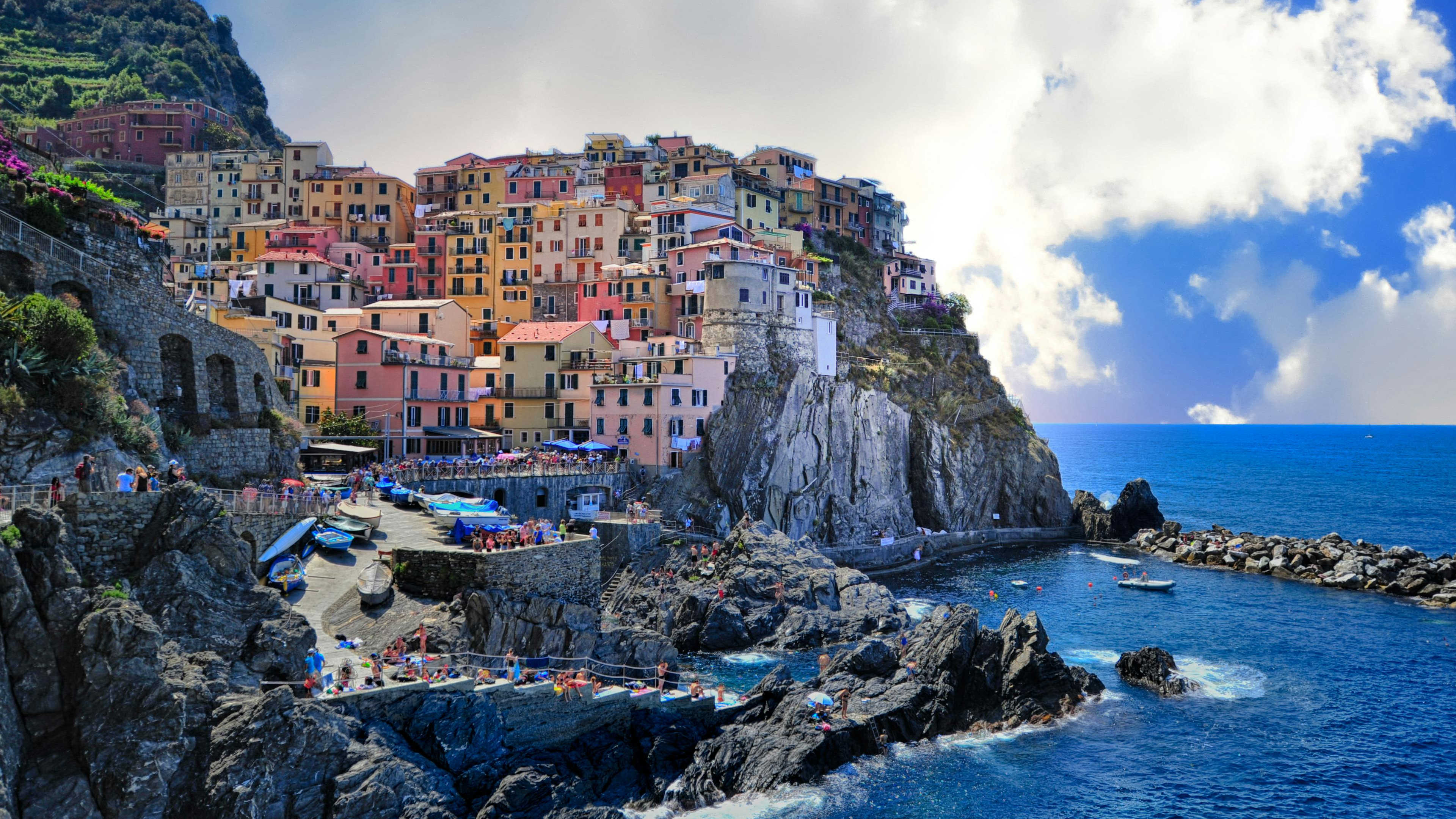 A colorful hillside village next to the sea