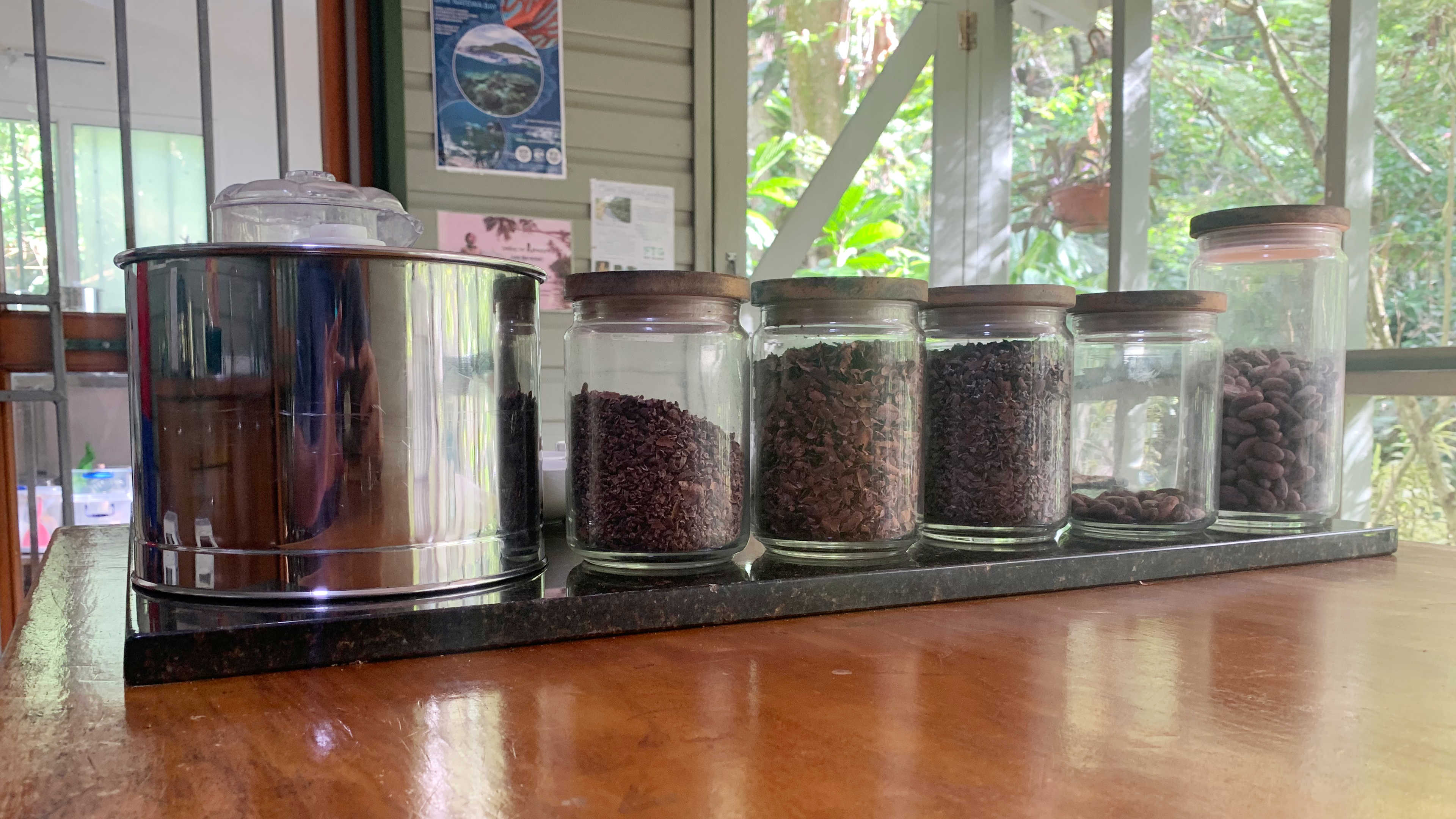 Jars with cocoa at various stages of processing