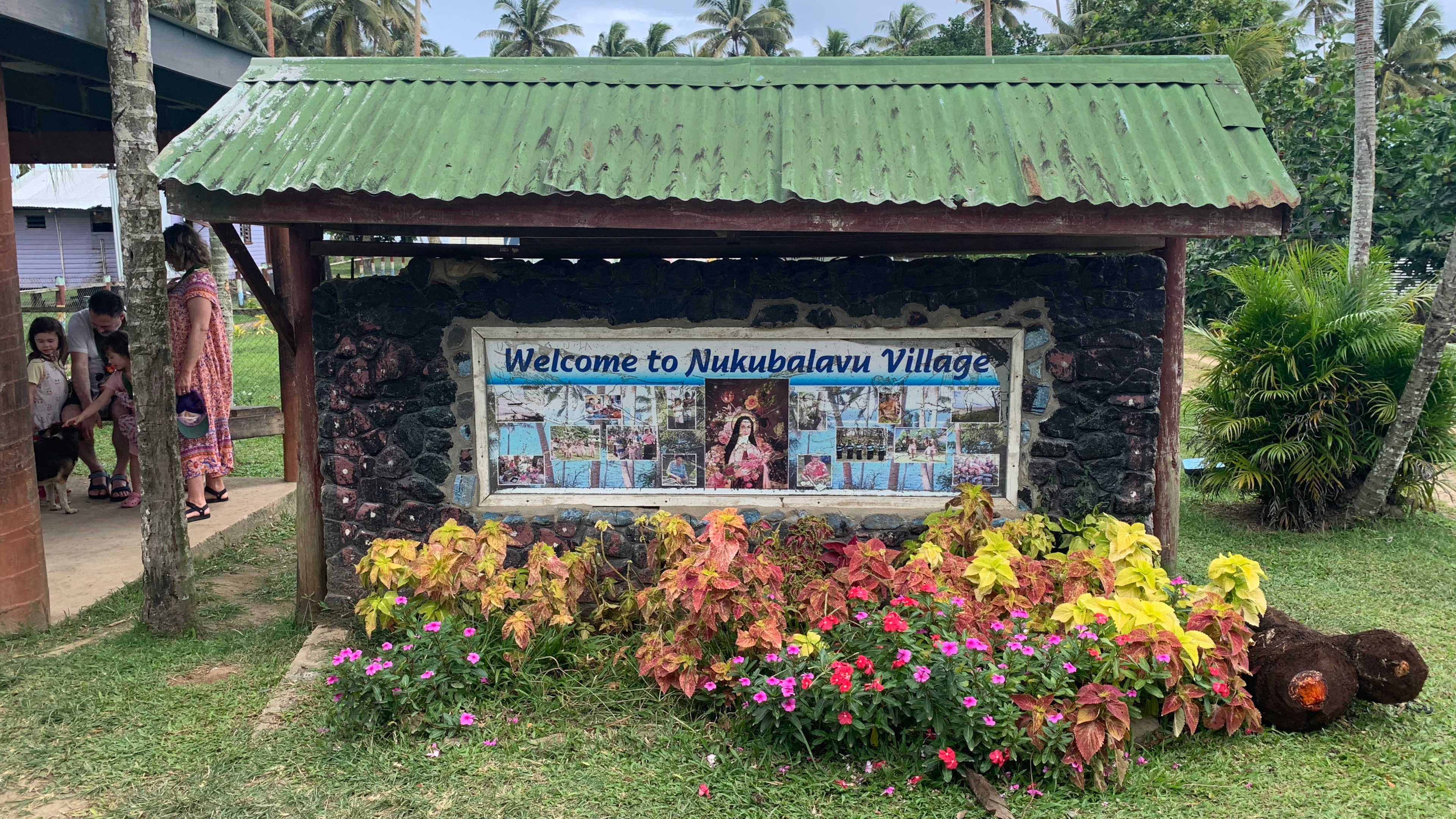 Me standing with my mom, brother and sister along with our Fijian resort host Gabi