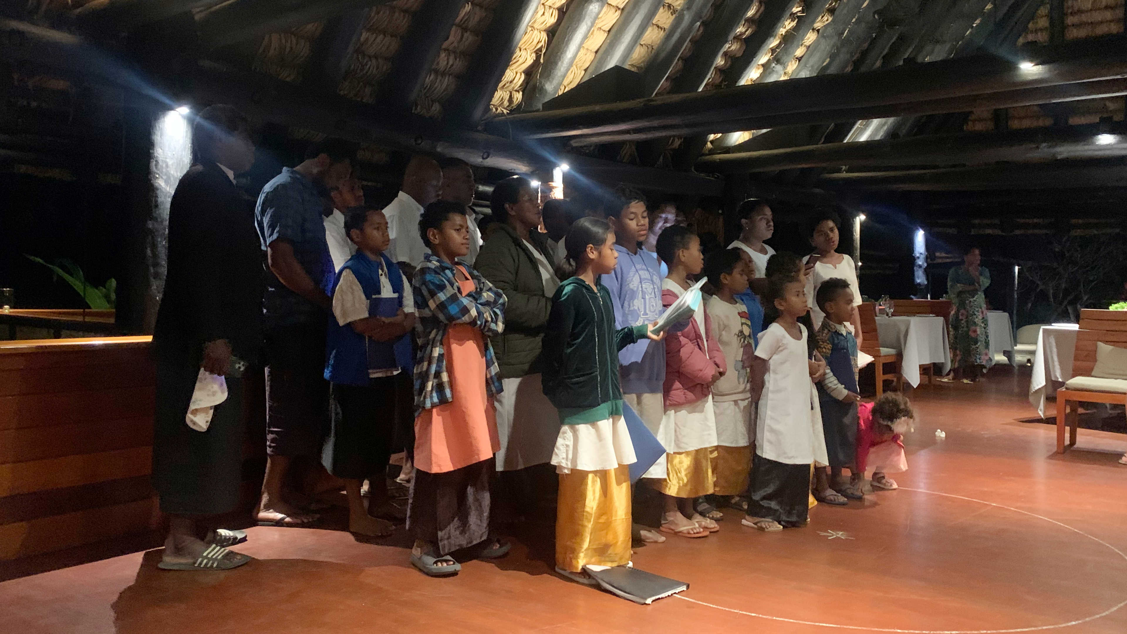 The village choir from Savudrodro standing in the Jean Michel Cousteau Resort in Savusavu, Fiji