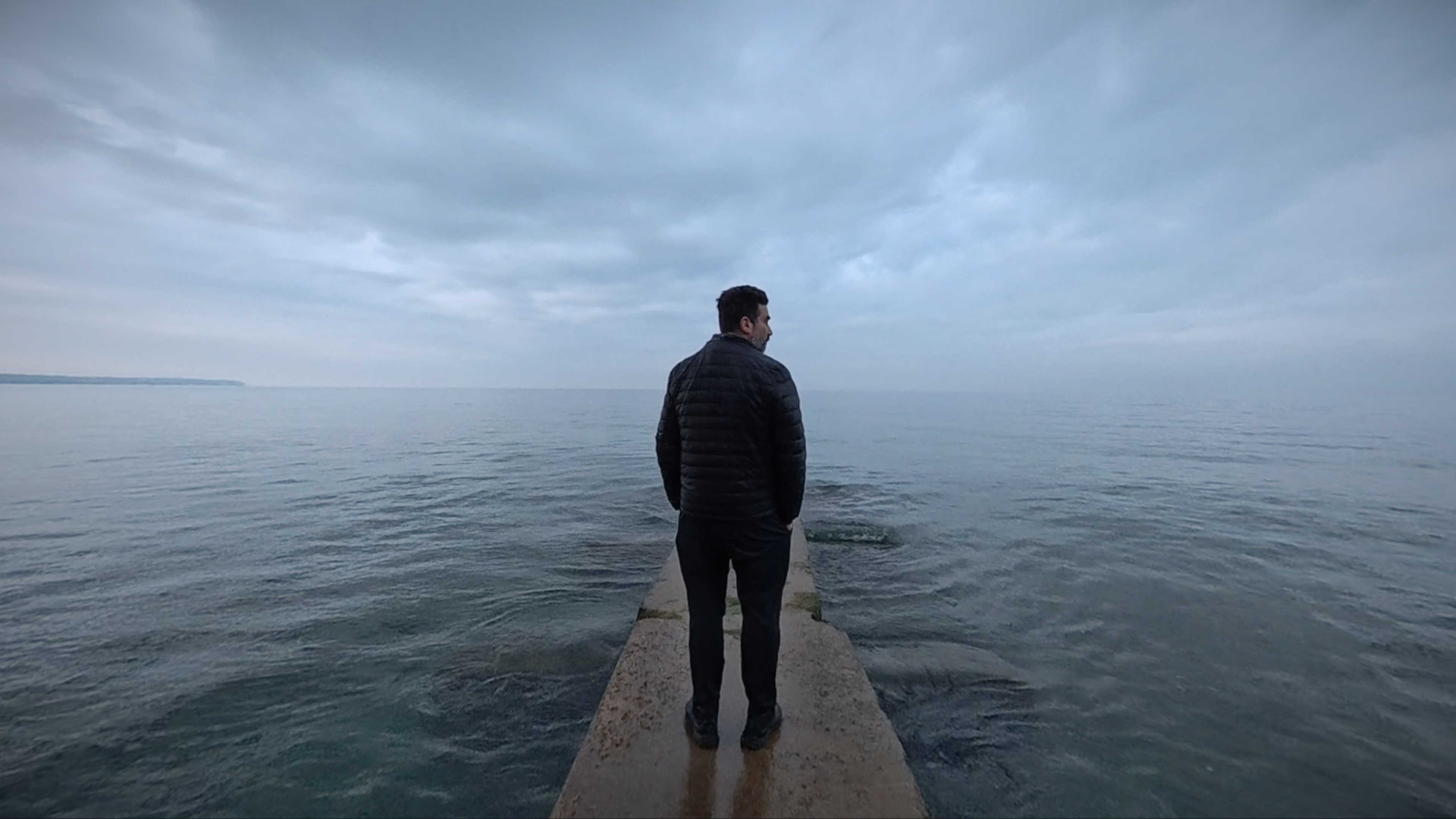 Shot of me from behind on the pier at Big Bay Park overlooking Lake Michigan