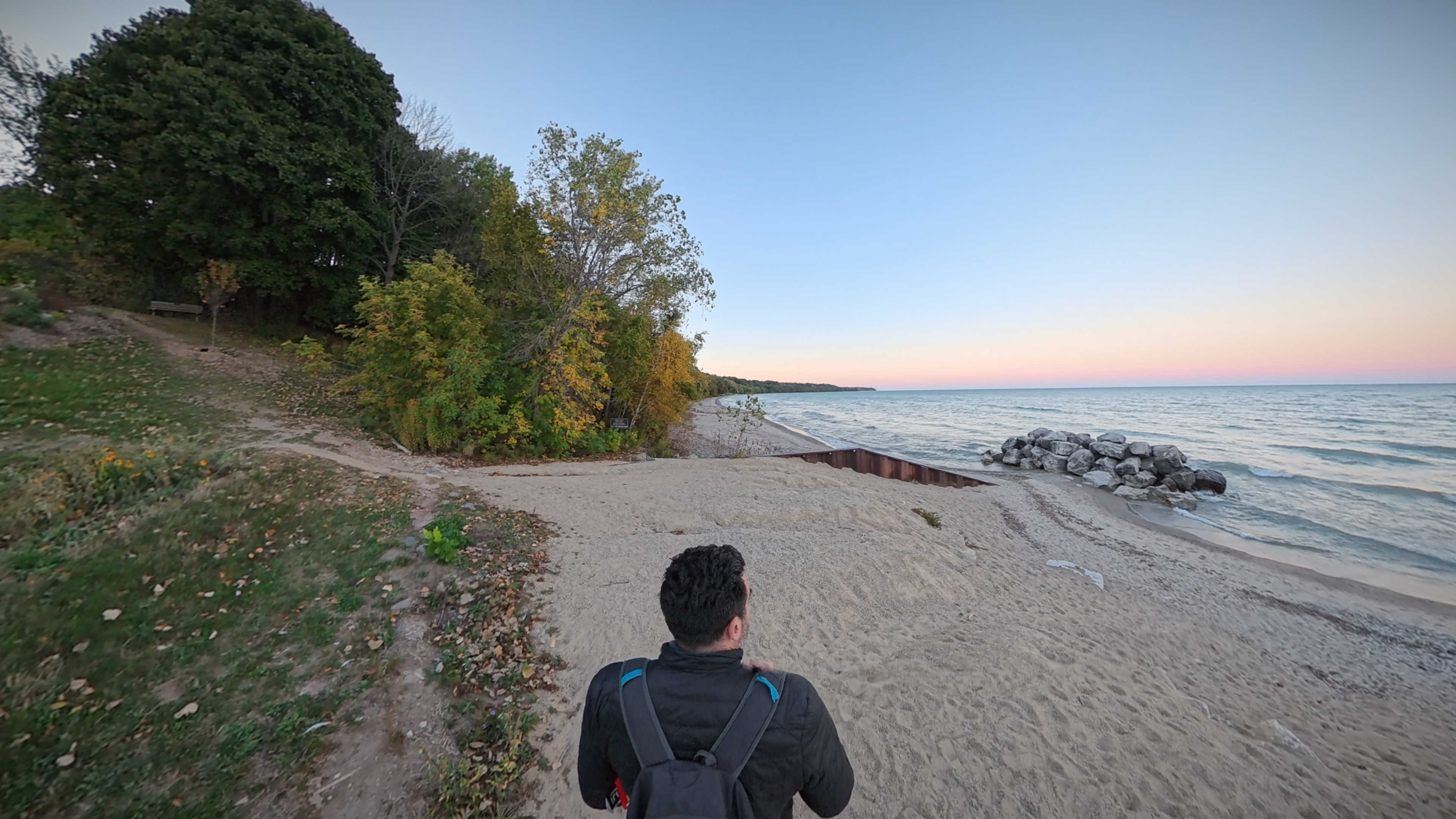 Me walking down the beach towards some rocks
